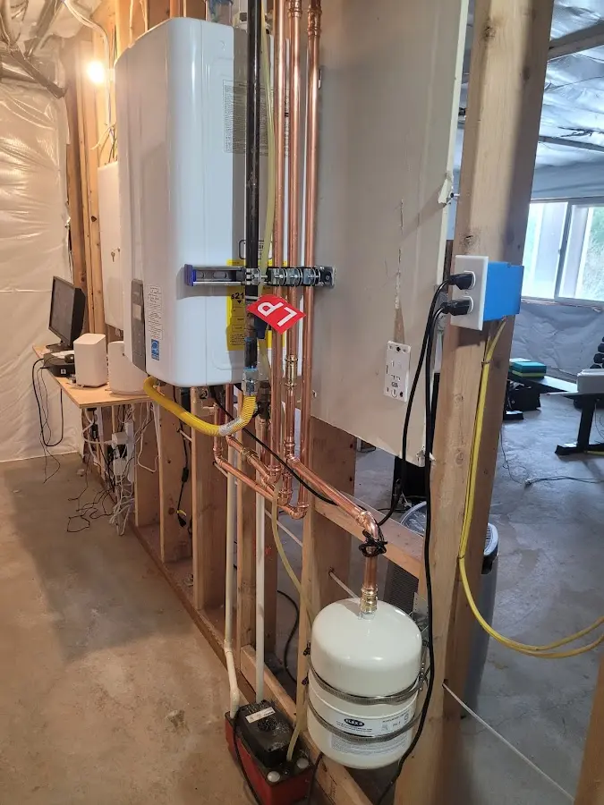 Licensed plumber repairing a kitchen sink in Aurora